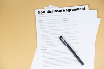 Obraz premium Non disclosure agreement (NDA) document on office desk, confidential legal contract for business privacy, data protection, and corporate trust concept.