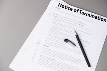 Notice of termination document on office desk, official HR paper announcing job dismissal or contract ending, symbol of decision, change, and professional transition.