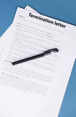 Obraz premium Termination letter on office desk, formal HR document ending employment, symbol of difficult workplace decision, job loss, and career transition in professional life.