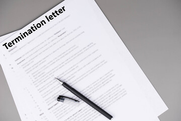 Obraz premium Termination letter on office desk, formal HR document ending employment, symbol of difficult workplace decision, job loss, and career transition in professional life.