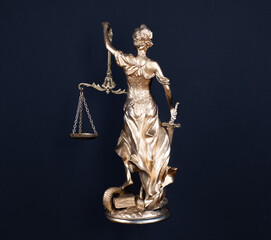 golden Goddess of Justice Themis isolated on black background