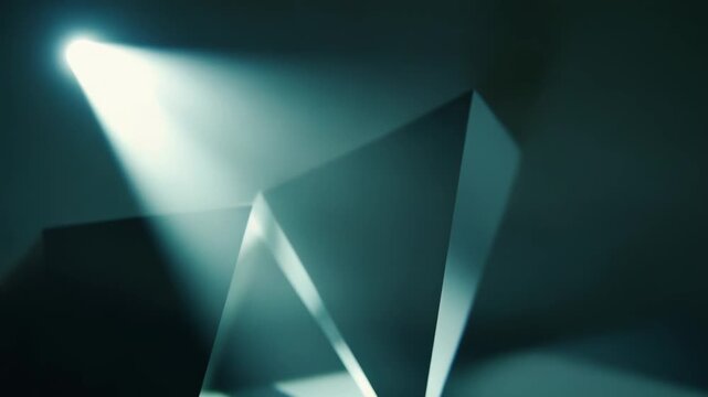 Abstract geometric forms creating a minimalist pattern with sharp lines and shadows, highlighting the interplay of light and dark surfaces forming a modern background