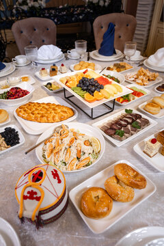 Kazakh national dastarkhan table with traditional decor and dishes