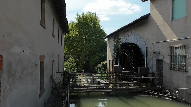 Panning over the old Water mill in Rosasco Village , Lombardy, Italy