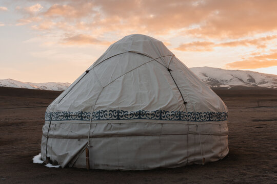 Traditional yurt on a scenic road trip through Central Asia