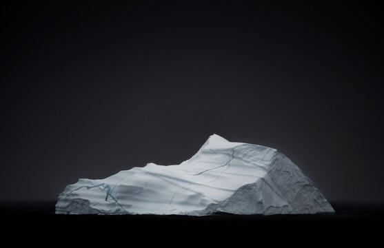 Majestic iceberg in Arctic waters at twilight