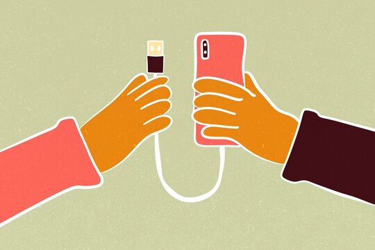Hands connecting phone with USB cable