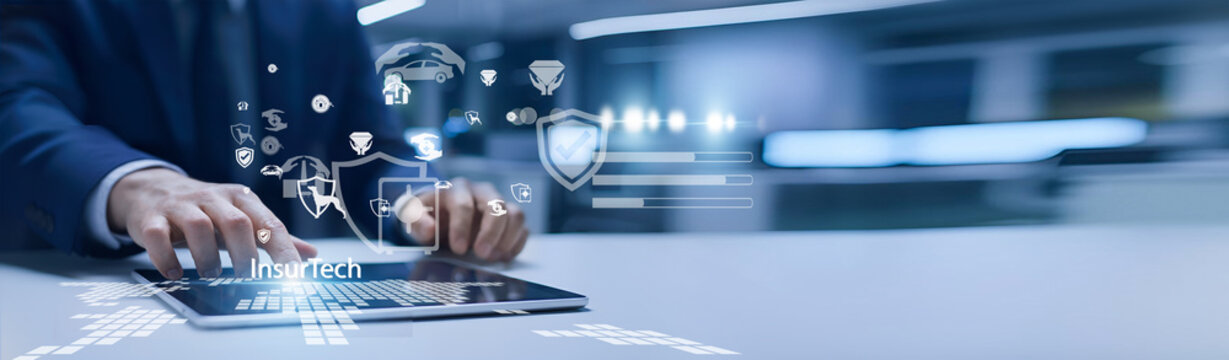 Insurance professional holding digital platform. InsurTech uses technology to streamline insurance services, claims, and customer experience.