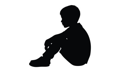 Young boy sitting and looking down in stark contrast a silhouette © MD RIPON
