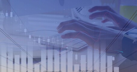Typing adult hands pressing compact keyboard at desk, showing mouse, wristwatch, financial charts