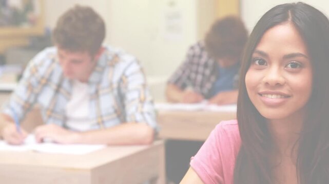 Animation of light background over diverse students during exam