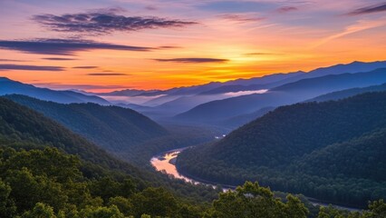 Fototapeta premium A serene landscape of rolling hills and a winding river at sunset