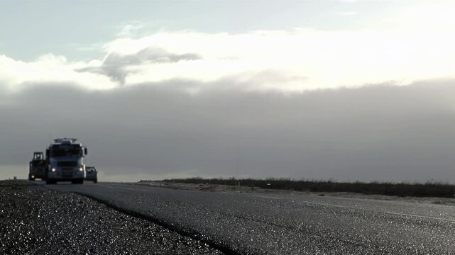 Freight Trucks Moving Through Patagonian Landscape, Argentina 