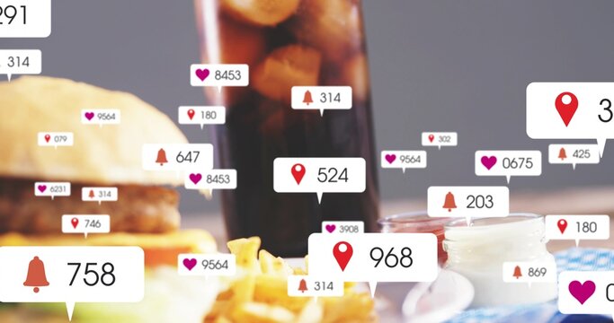 Displaying burger and fries sitting on tabletop, with cola ketchup mayo napkin social badges