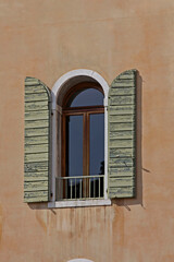 Obraz premium One Window With Open Shutters in Venice Italy