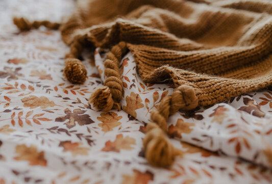 Close up of fall sheets and a cozy throw 