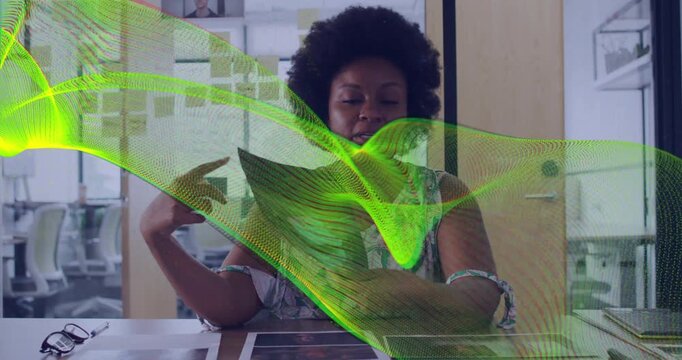 Woman lifting sheet, holding booklet for business review while green ribbon covering face and desk