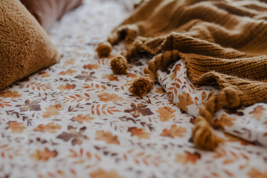 close up of fall sheets and a cozy throw 