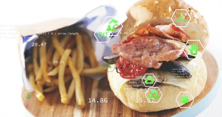 Fototapeta premium Showing bacon-topped burger sitting right on wood board, with fry cone, blue paper, green UI