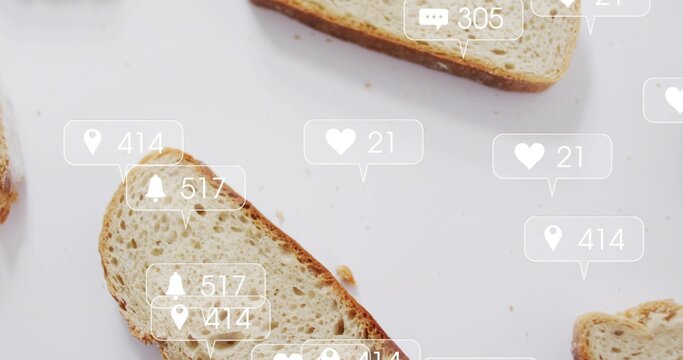 Featuring angled slice of seeded bread sitting on white surface, with crumbs and notification icons