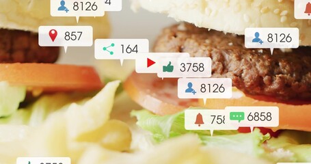 Showing stacked burger with sesame bun, beef patty at tabletop, tomato lettuce fries callouts © vectorfusionart