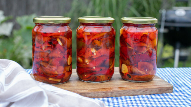 Jars of vibrant pickled peppers whisper savory sonnets of preservation, echoing harvest festivals and Appalachian folk traditions