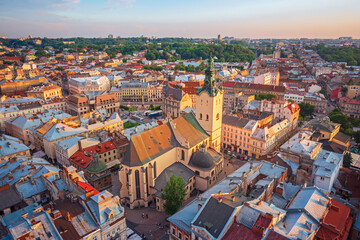 Aerial drone view of Lviv, Ukraine featuring historic churches, cathedral towers, and colorful...