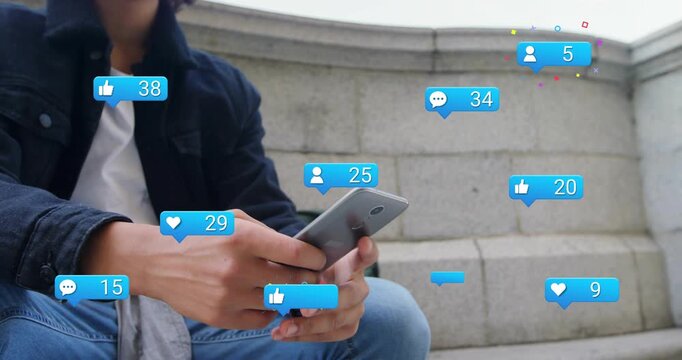 Man sitting steps with phone scrolling and sparking social media icons filling shot showing growth