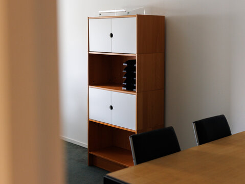 An empty office with an office cabinet.