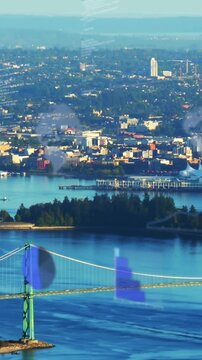 Vertical video: Cargo ship coming left, heading right under green span, exiting, blue flaring