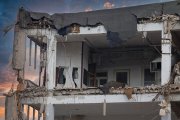 Demolition of an old building using heavy construction equipment. A scene showing the dismantling process, debris, and site preparation for a new development. © jarizPJ