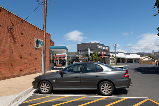 Holden commodore vehicle parked in a quiet country town