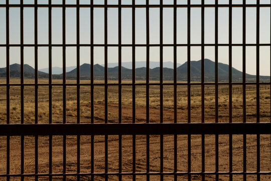 Santa Fe, New Mexico. Behind the bars looking at the Sangre de Christo Mountains