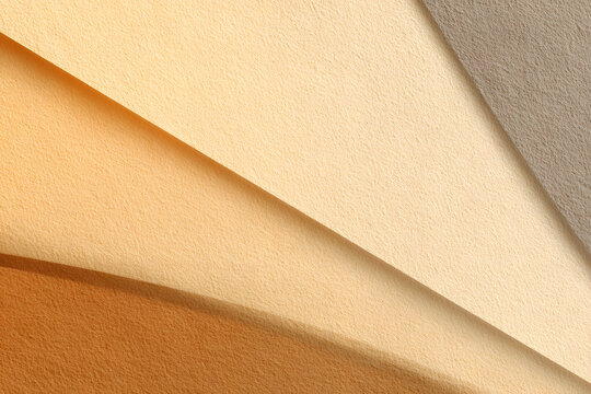 Textures of layered paper in warm colors create a simple design that catches attention