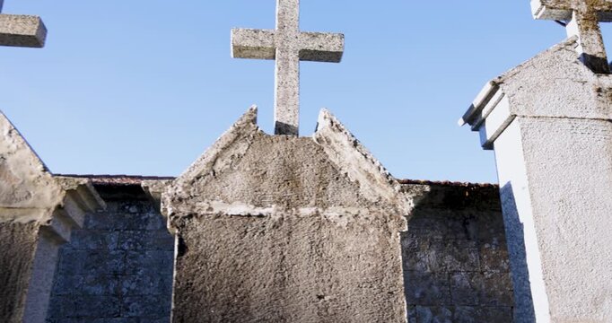 A cemetery with a row of white crosses