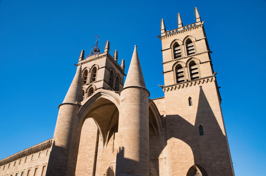St. Peter's Cathedral in Montpellier, notable for its Gothic architecture, characterized by its two massive towers on the main fa&ccedil;ade, city of Montpellier, France.