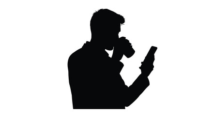 Man drinking coffee and using phone striking dark silhouette © asma