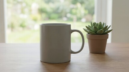 Obraz premium Cozy Morning Still Life: A simple, elegant coffee mug and succulent, bathed in soft, natural light, creating a sense of calm and a perfect start to the day.