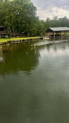 Obraz premium A serene lakeside scene featuring a calm body of water with gentle ripples