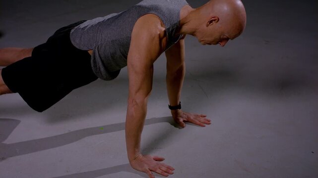 Middle Aged Man Push Ups Side View Closeup In Studio