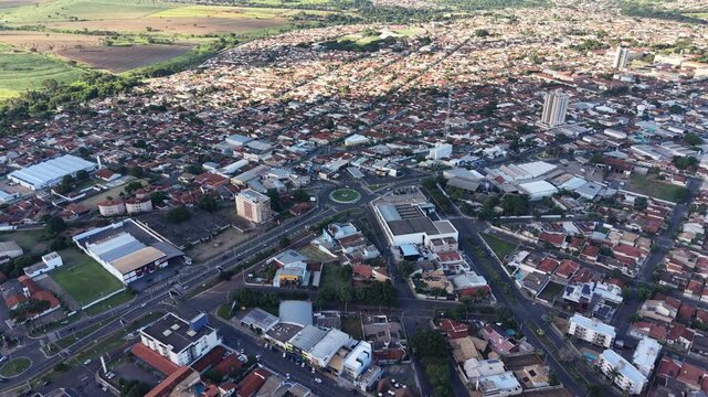 Aerial video footage of a bustling urban cityscape with a mix of modern and traditional architecture
