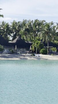 Luxury Beachfront Villa with Thatched Roof on Turquoise Lagoon in Bora Bora, French Polynesia