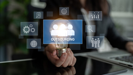 Outsourcing concept showing collaboration, delegation, global workforce, productivity, and task management through remote teams and external service providers Latch