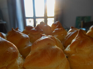 Fresh Eclairs and Choux Pastries with Custard – Delicious Dessert Flat lay