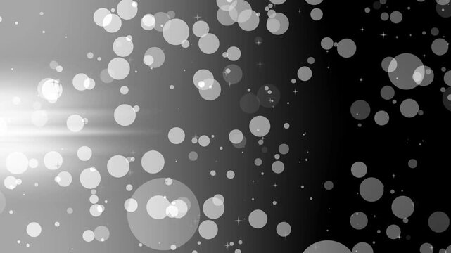 Abstract bokeh background with light flares and scattered circular light spots animation, soft gradient from left light to deeper right small sparkles