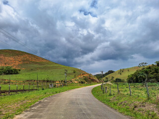 Country Road Under Dramatic Cloudy Sky © Leonardo Araújo