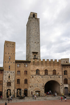  Palazzo Vecchio del Podesta and the Rognosa Tower, also known as the Clock Tower or Podesta Tower in Piazza del Duomo in San Gimignano.