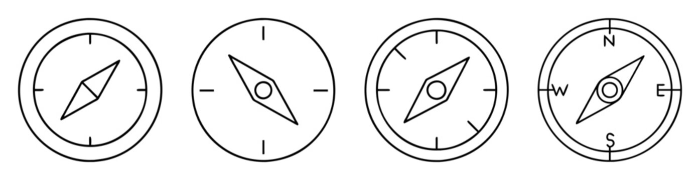 Set of four compasses in various orientations and designs in line art