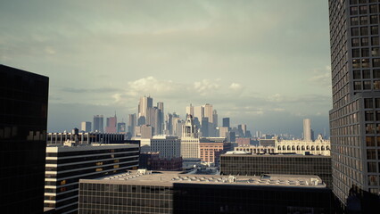 Fototapeta premium sunlit rooftop panorama of skyline with bustling foreground, drone operator capturing timelapse, cranes and construction details, commuter energy and traffic