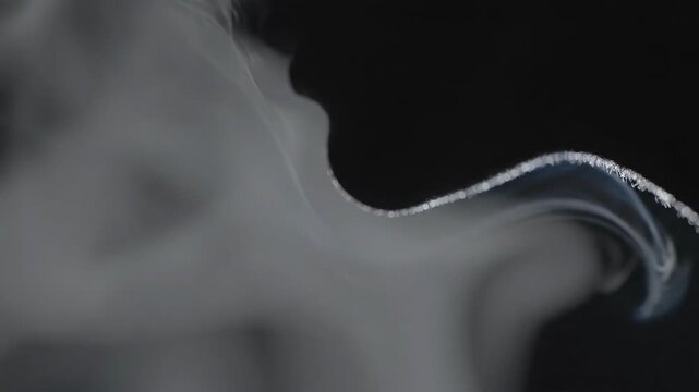 A captivating, ethereal image of swirling smoke against a dark background, perfect for conveying mystery, transformation, or a sense of the intangible